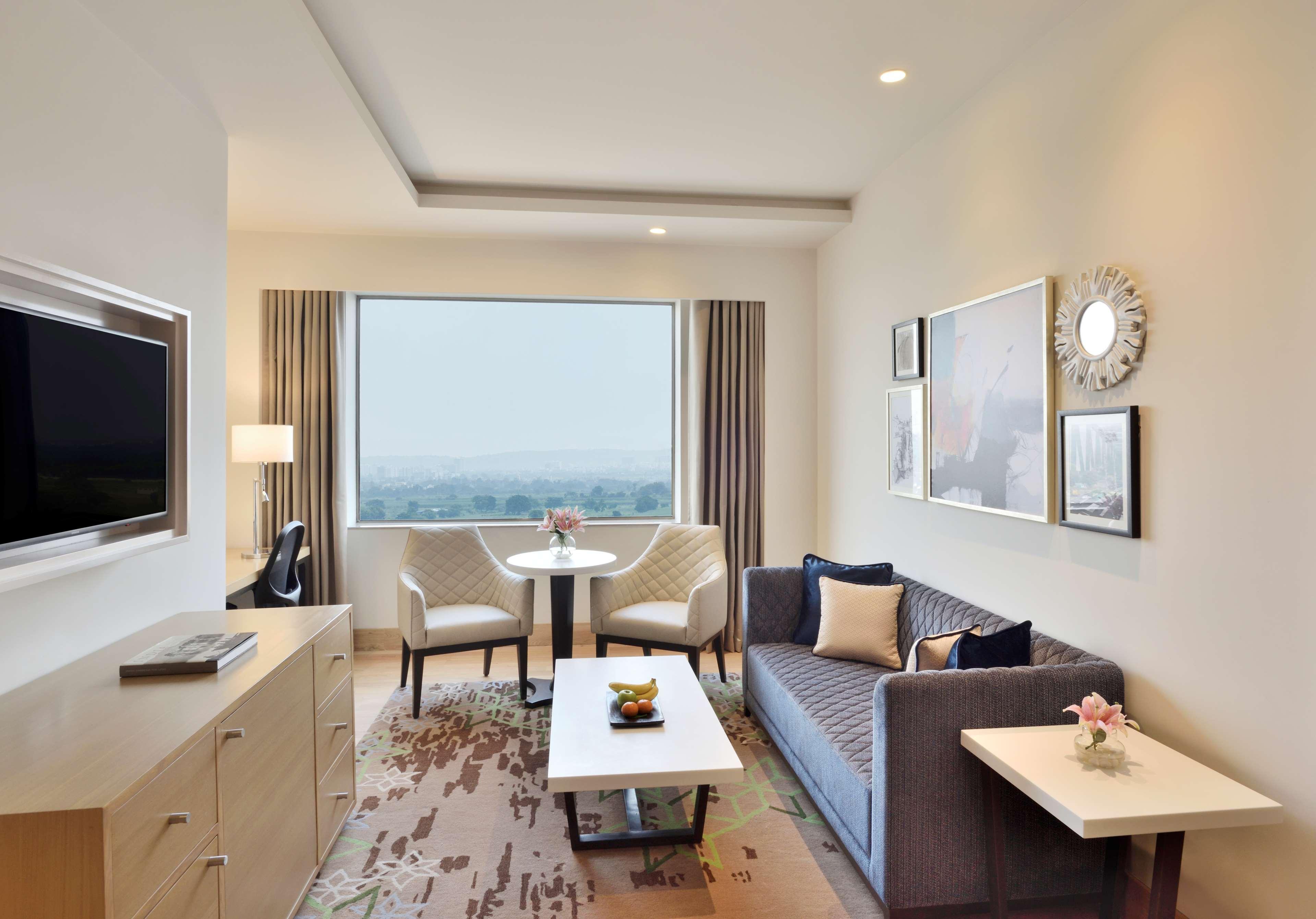 Radisson Gurugram Udyog Vihar Hotel Gurgaon Exterior photo Living room of a suite